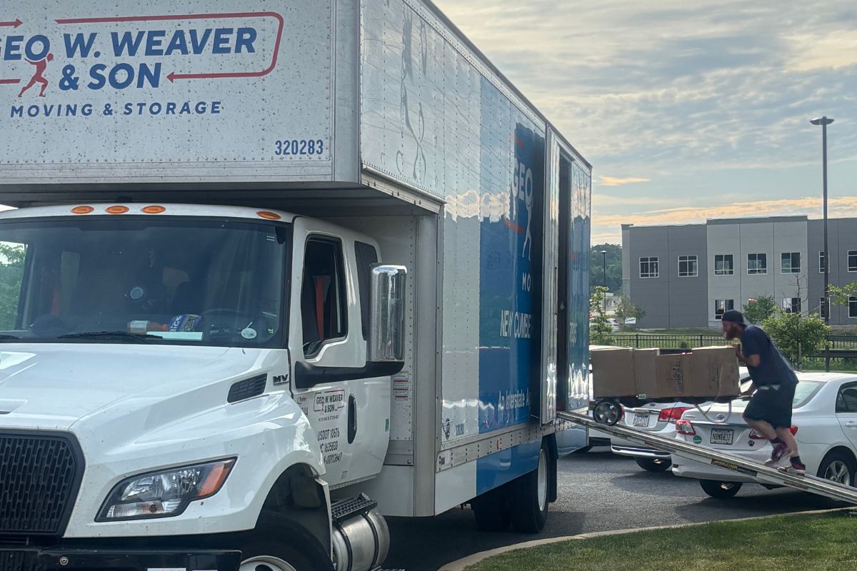 A photo of a Geo. W. Weaver and Son employee loading the truck for a long-distance move